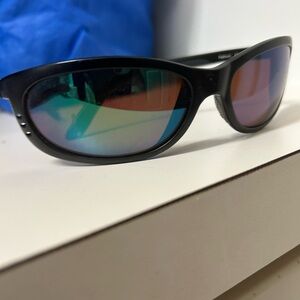 Costa Del Mar Fathom 580 green glass lens